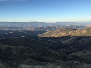 The sun just making its appearance in the valley below